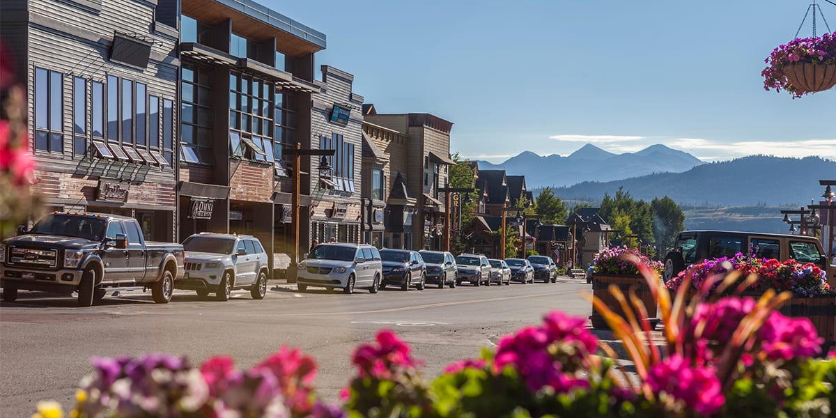 Frisco Main Street with flowers and Greys and Torreys Mountain Peaks in the background