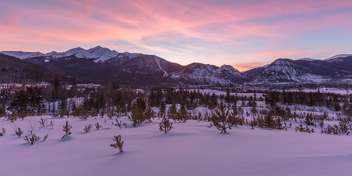 View of the Ten Mile Mountain Range near Frisco covered in snow with sunset