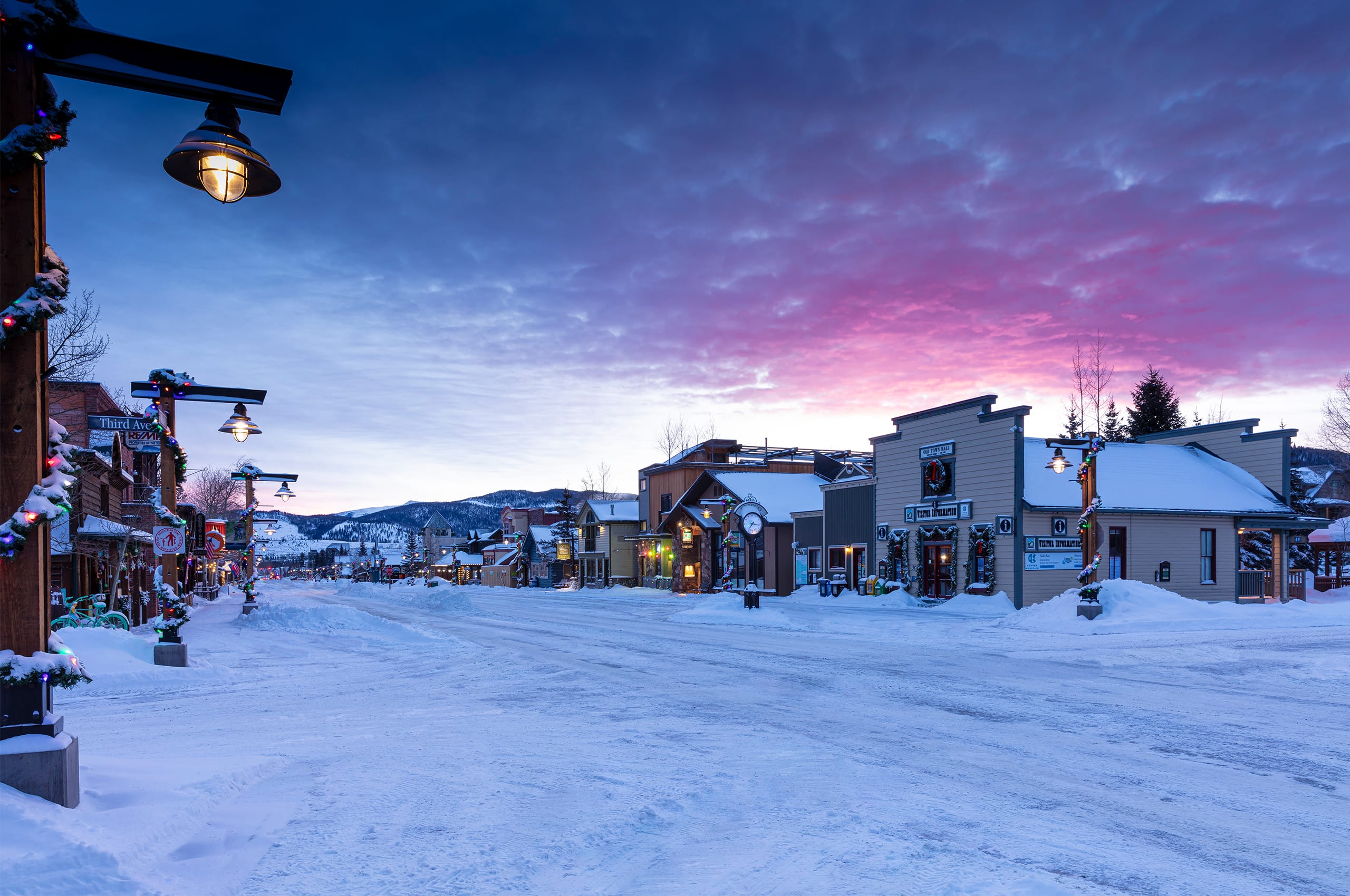 Frisco Main Street and Info Center in winter with purple sky