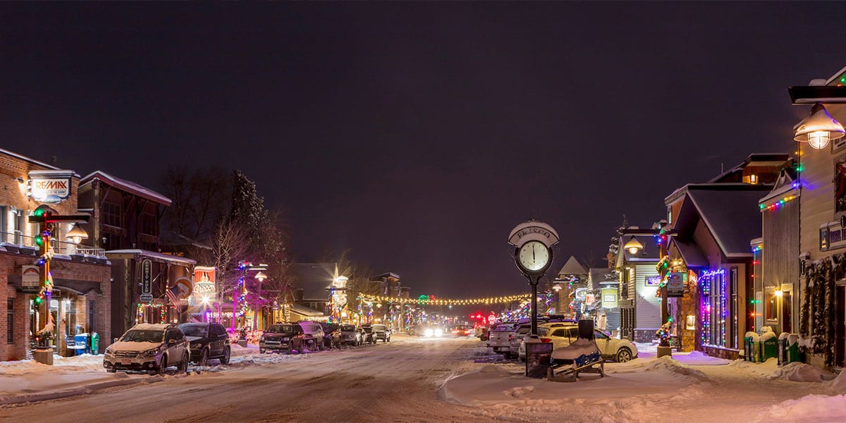Snow covered Main Street at night, facing east