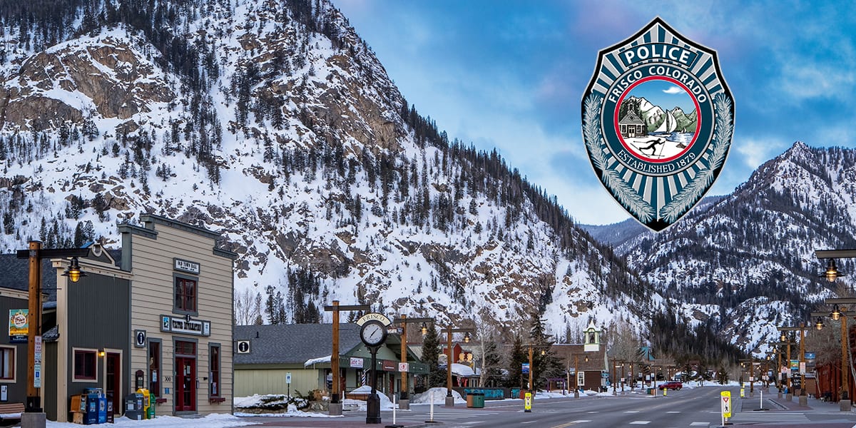 Frisco Main Street with snow and Mount Royal in the background and Frisco Police logo