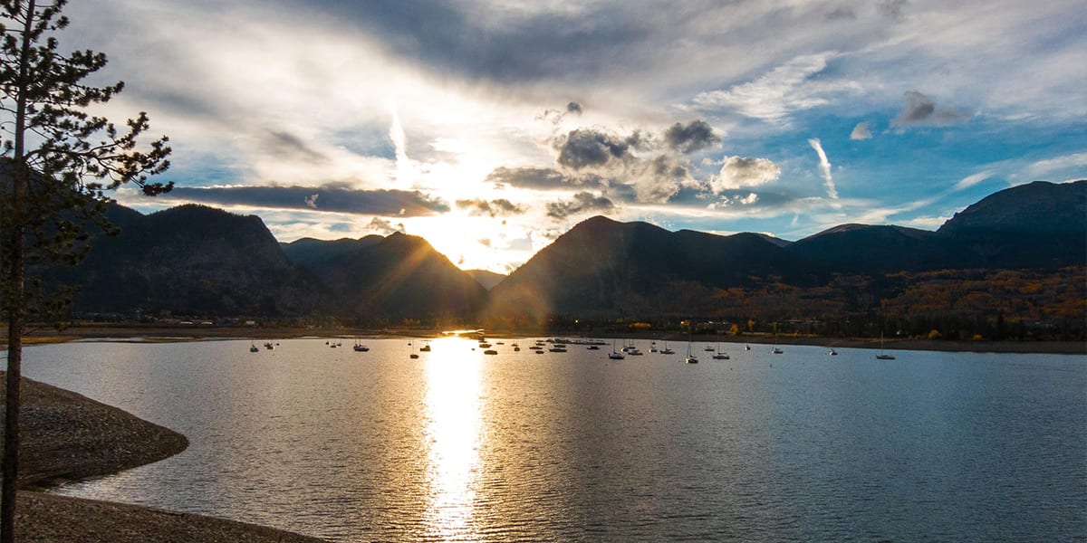 Lake Dillon at sunset with boats on the water