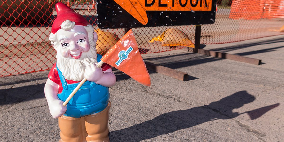Jerome the Construction Gnome in front of Detour sign