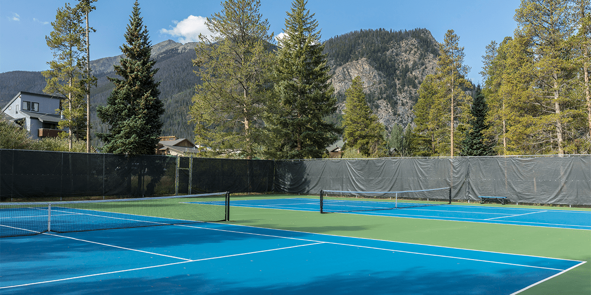 Tennis court at Pioneer Park with Mt. Royal in the background