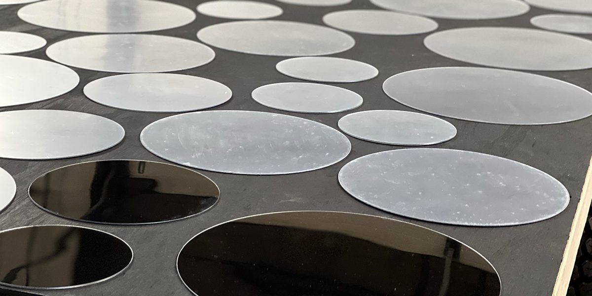 Construction photo of the art project being built by Frisco Public Works- Mirror discs on a black painted board