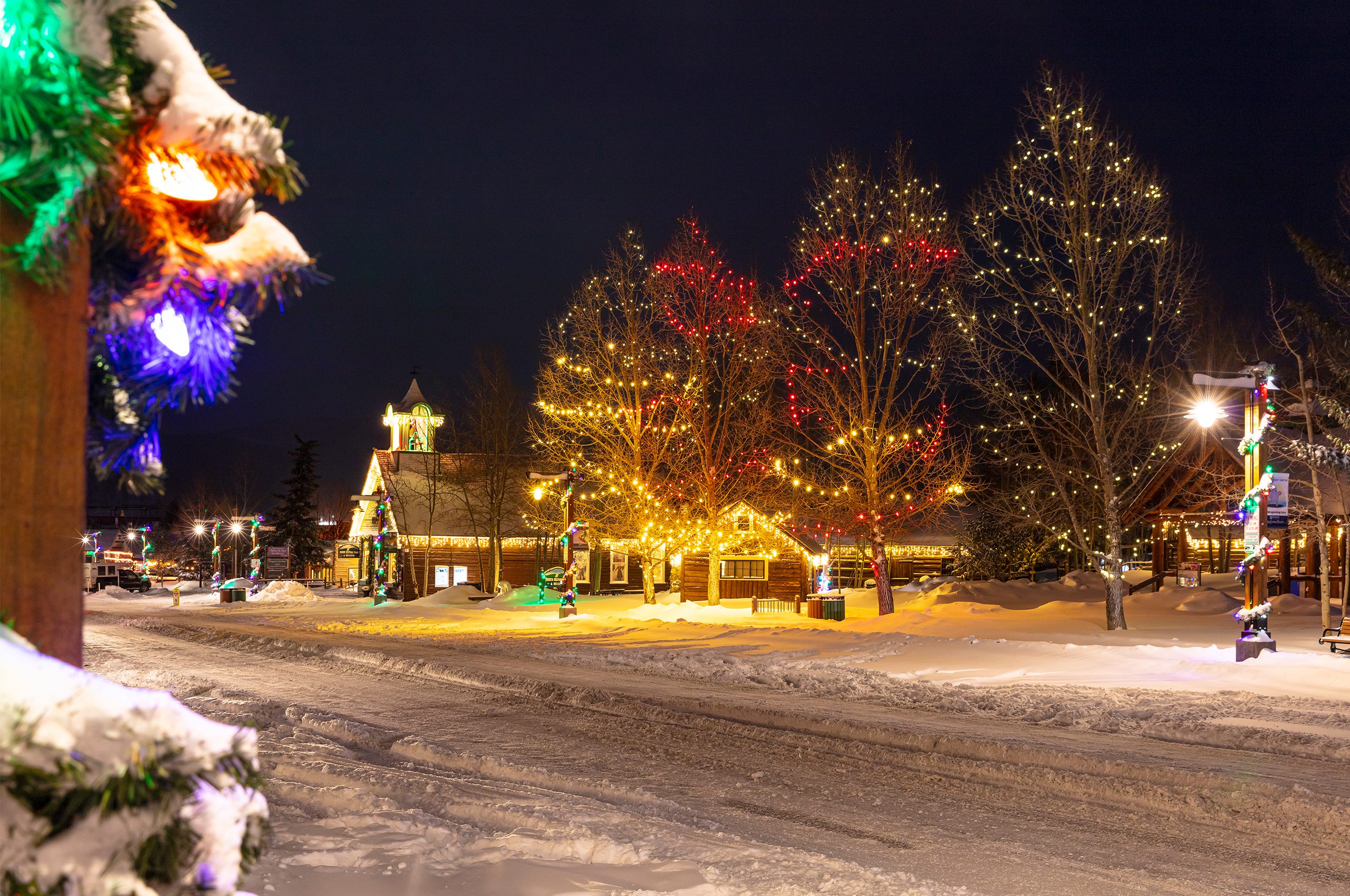 Snow on Main Street and holiday lights in Historic Park