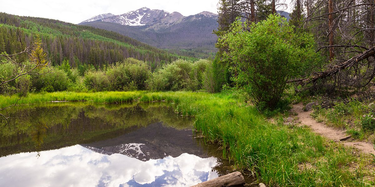 Lake with trail and Peak One in the background