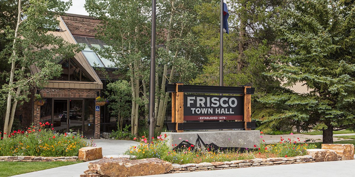 Frisco Town Hall during the summer with flowers