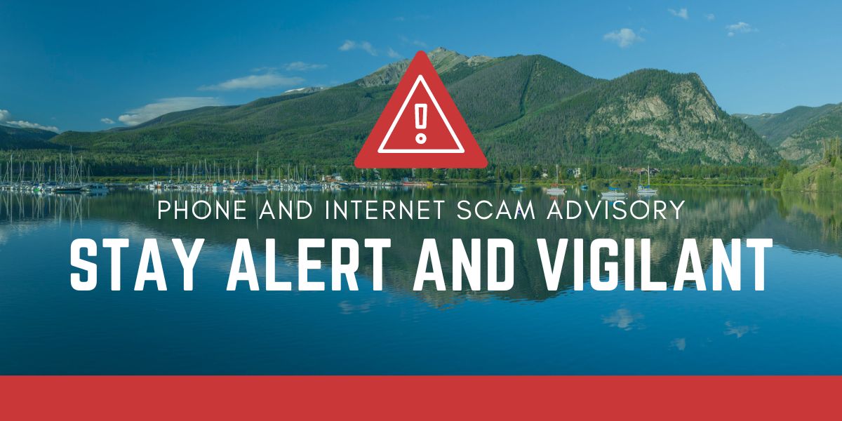 Photo of Dillon Reservoir with the copy "Phone and Internet Scam Advisory. Stay Alert and Vigilant"