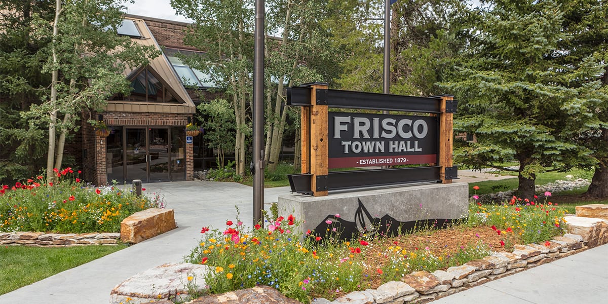 Frisco Town Hall building surrounded by aspen and evergreen trees