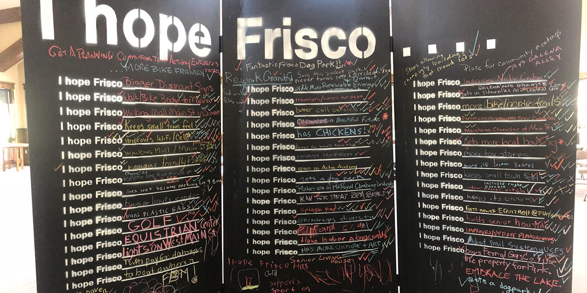Chalk board listing several community suggested improvements or goals for the town of Frisco