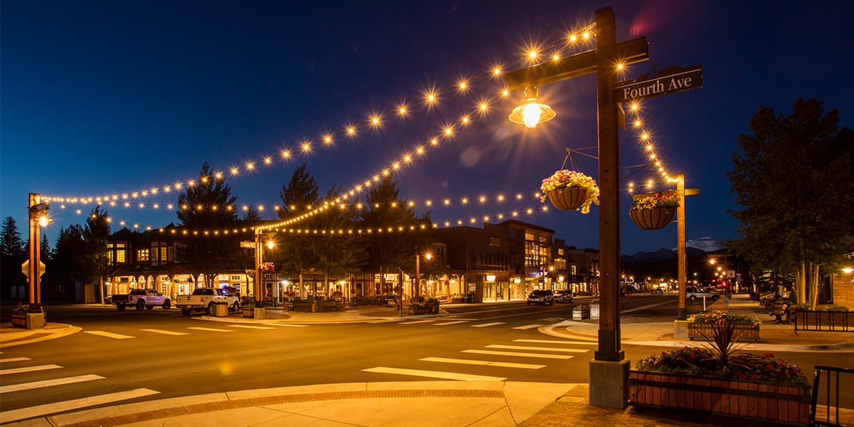 Fourth Avenue at night with lights across the intersection