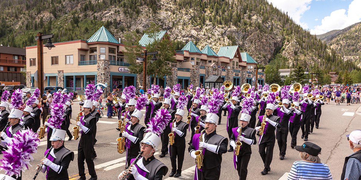 A large marching band plays for the fourth of july parade