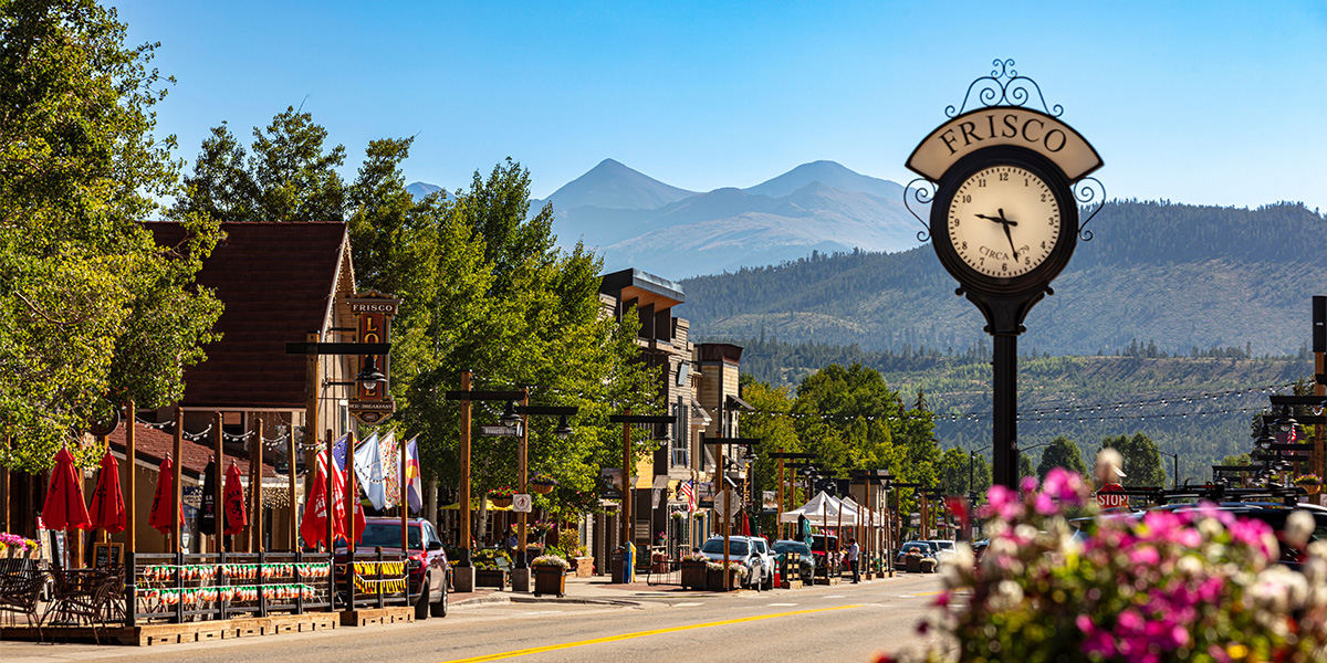 Frisco Main Street with Frisco clock and flower in summer