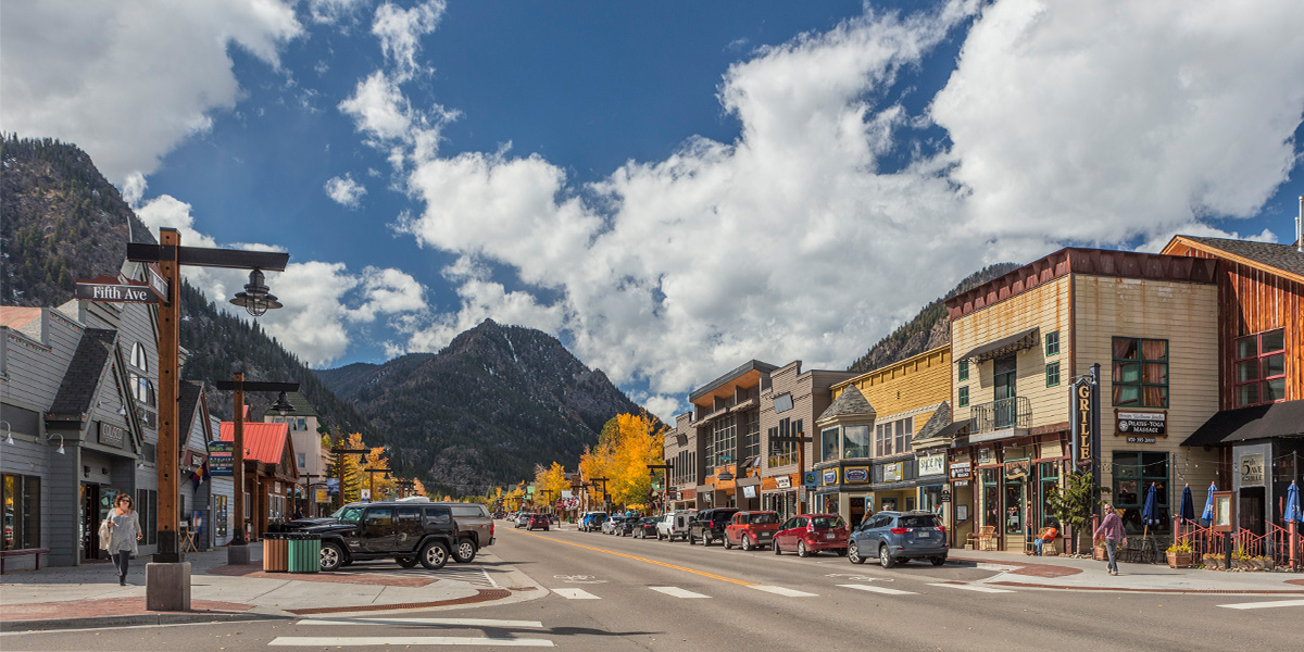 Frisco Main Street with cars parked on street in the fall