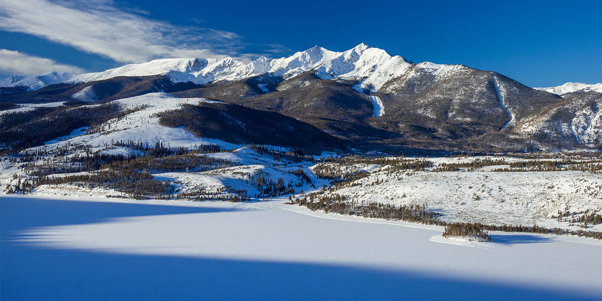 Peak One and Dillon Reservoir covered in snow in winter