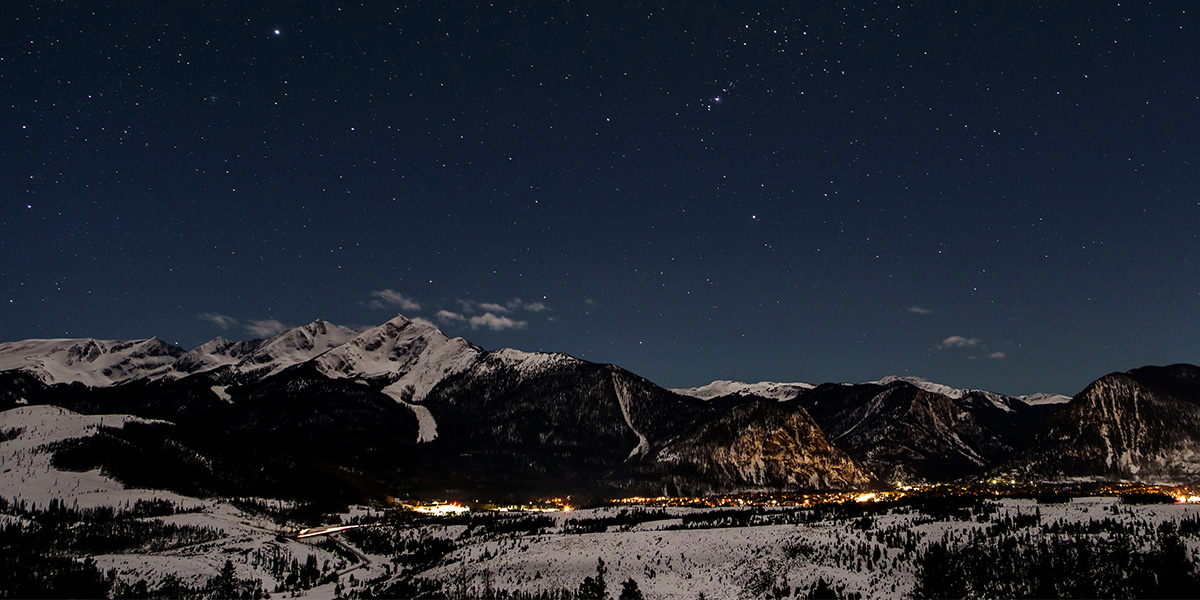 View of Peak One and Frisco at night with stars in the sky